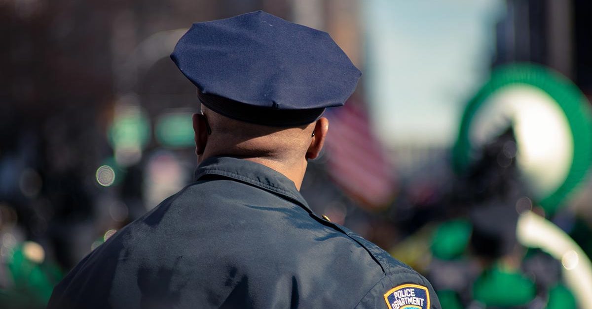 over the shoulder of police officer