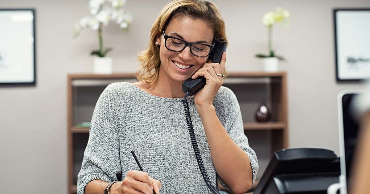 Happy mature woman talking on phone