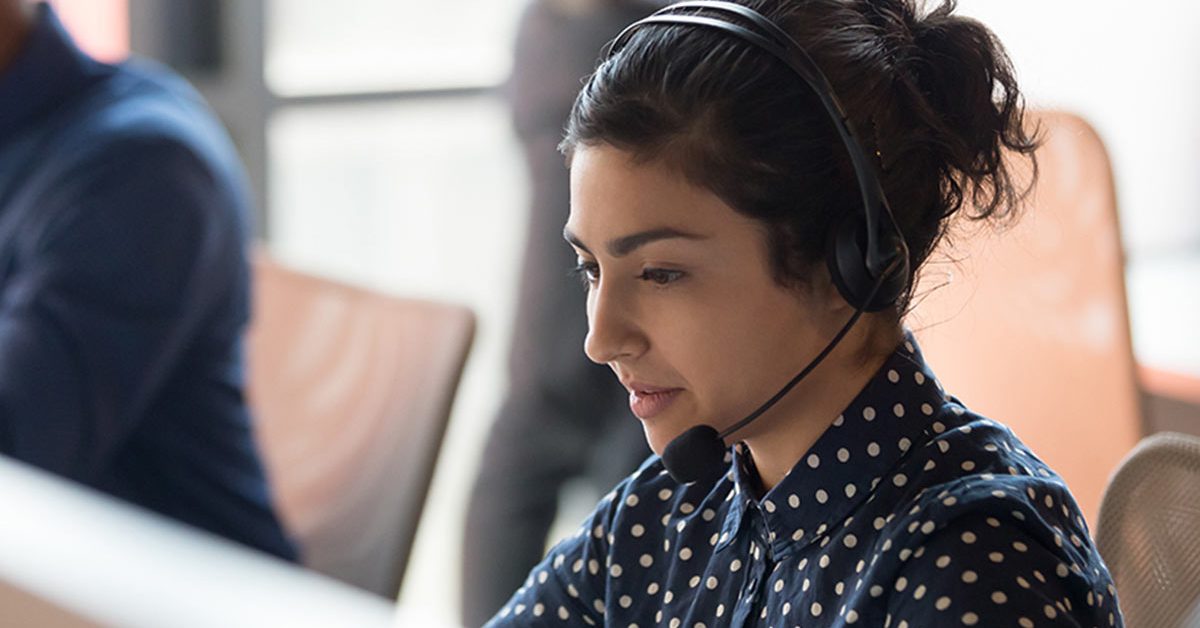 young contact center agent with phone headset